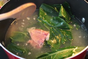 Cooking collards with a ham bone.